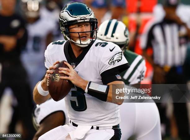 Matt McGloin of the Philadelphia Eagles looks to pass against the New York Jets during their preseason game at MetLife Stadium on August 31, 2017 in...