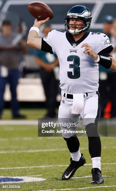 Matt McGloin of the Philadelphia Eagles looks to pass against the New York Jets during their preseason game at MetLife Stadium on August 31, 2017 in...