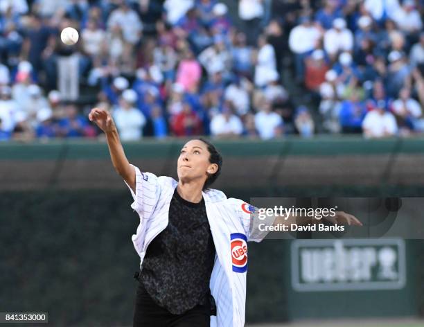 Christen Press of the U.S. Women's National Soccer Team throws out a ceremonial first pitch before the game between the Chicago Cubs and the Atlanta...