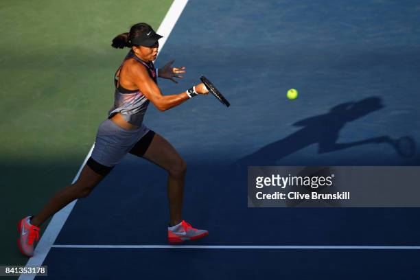Risa Ozaki of Japan returns a shot against Saisai Zheng of China on Day Four of the 2017 US Open at the USTA Billie Jean King National Tennis Center...