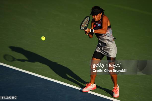 Risa Ozaki of Japan returns a shot against Saisai Zheng of China on Day Four of the 2017 US Open at the USTA Billie Jean King National Tennis Center...