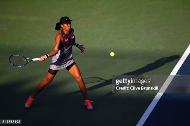 Risa Ozaki of Japan returns a shot against Saisai Zheng of China on Day Four of the 2017 US Open at the USTA Billie Jean King National Tennis Center...