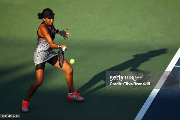 Risa Ozaki of Japan returns a shot against Saisai Zheng of China on Day Four of the 2017 US Open at the USTA Billie Jean King National Tennis Center...