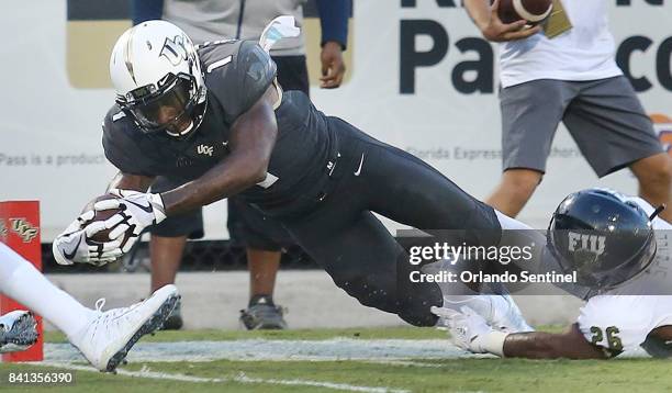 Running back Jawon Hamilton dives into the end zone to finish a 16-yard touchdown run against Florida International at Spectrum Stadium in Orlando,...