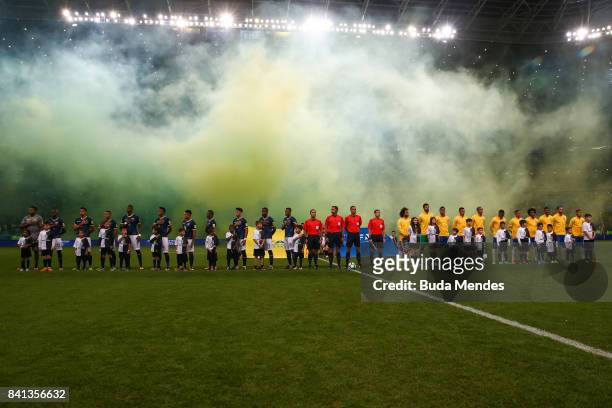 Players of Brazil and Ecuador enter to the field during a match between Brazil and Ecuador as part of 2018 FIFA World Cup Russia Qualifier at Arena...