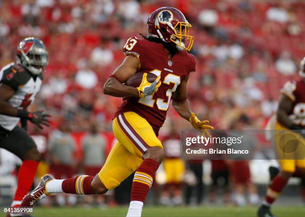 Wide receiver Maurice Harris of the Washington Redskins runs for several yards during the first quarter of an NFL preseason football game against the...