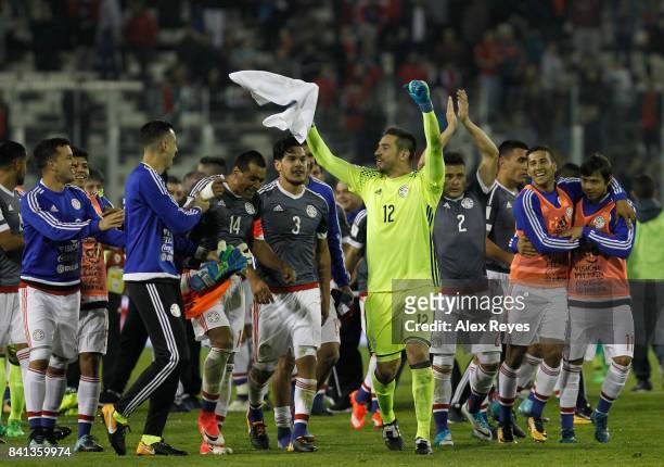 Players of Paraguay celebrate after defeating Chile in a match between Chile and Paraguay as part of FIFA 2018 World Cup Qualifiers at Monumental...