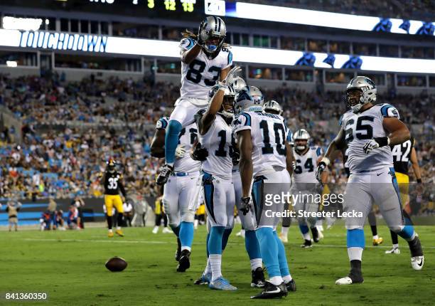 Damiere Byrd of the Carolina Panthers celebrates after scoring a touchdown with teammate Curtis Samuel of the Carolina Panthers during their game...