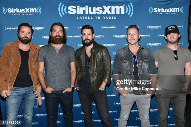 Brad Tursi, Geoff Sprung, Matthew Ramsey, Trevor Rosen, and Whit Sellers of Old Dominion pose before a private concert for SiriusXM at The Cutting...