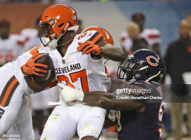 Lamarr Houston of the Chicago Bears brings down Matt Dayes of the Cleveland Browns during a preseason game at Soldier Field on August 31, 2017 in...