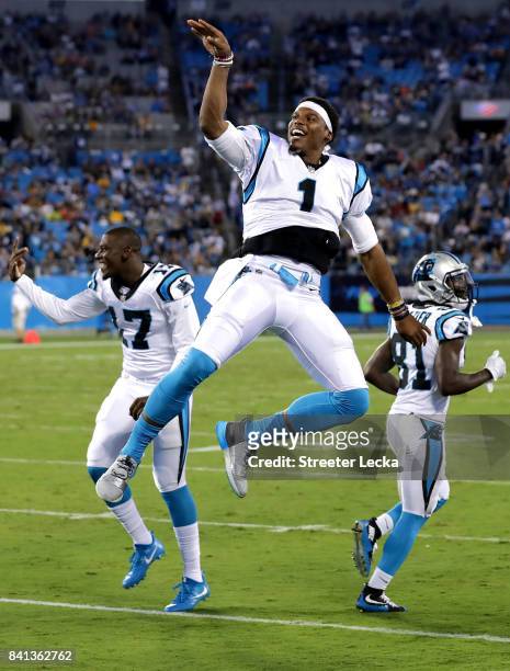Cam Newton of the Carolina Panthers reacts on the sidelines against the Pittsburgh Steelers during their game at Bank of America Stadium on August...