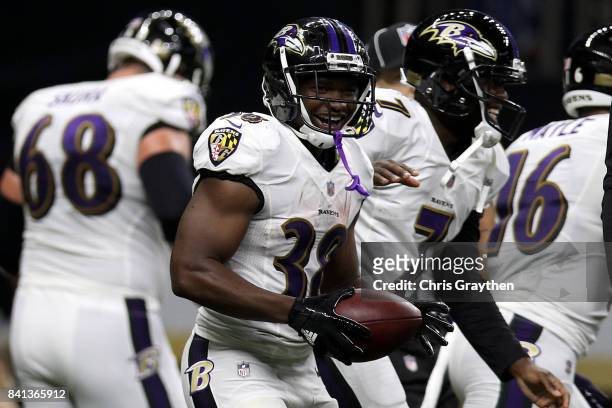 Thad Lewis of the Baltimore Ravens and Bobby Rainey of the Baltimore Ravens celebrate after a touchdown against the New Orleans Saints at...