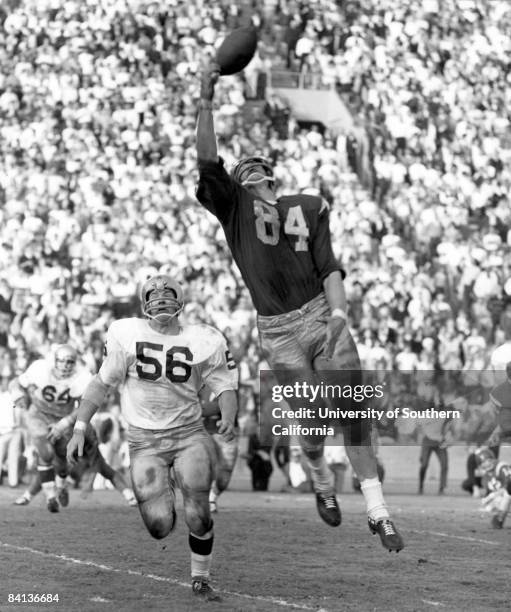 Trojans receiver Bob Klein goes up high for a pass during a 51-0 loss to the Notre Dame Fighting Irish on November 26, 1966.