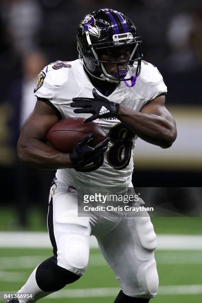 Bobby Rainey of the Baltimore Ravens in action against the New Orleans Saints at Mercedes-Benz Superdome on August 31, 2017 in New Orleans, Louisiana.