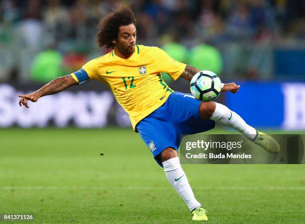 Marcelo of Brazil kicks the ball with of Ecuador during a match between Brazil and Ecuador as part of 2018 FIFA World Cup Russia Qualifier at Arena...