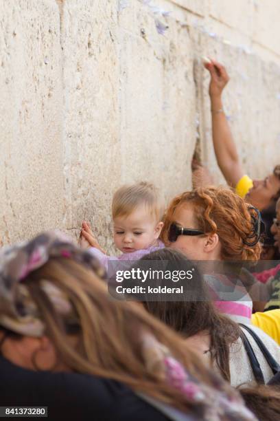 women praying next to western wall in jerusalem - wailing wall stock pictures, royalty-free photos & images