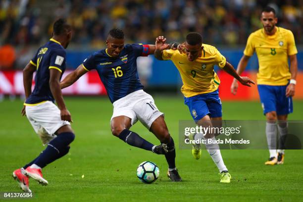 Gabriel Jesus of Brazil struggles for the ball with Antonio Valencia of Ecuador during a match between Brazil and Ecuador as part of 2018 FIFA World...