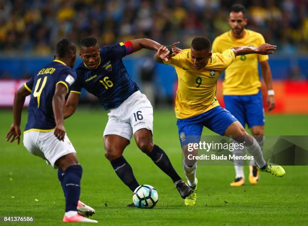 Gabriel Jesus of Brazil struggles for the ball with Antonio Valencia of Ecuador during a match between Brazil and Ecuador as part of 2018 FIFA World...