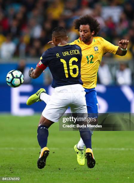 Marcelo of Brazil struggles for the ball with Antonio Valencia of Ecuador during a match between Brazil and Ecuador as part of 2018 FIFA World Cup...