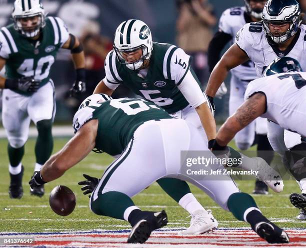 Jeff Adams recovers the fumble of Christian Hackenberg of the New York Jets during their preseason game against the Philadelphia Eagles at MetLife...