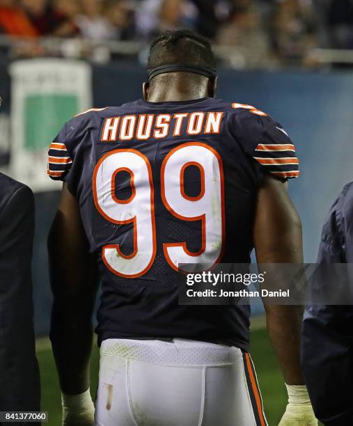 Lamarr Houston of the Chicago Bears walks to the locker room after suffering an injury against the Cleveland Browns during a preseason game at...