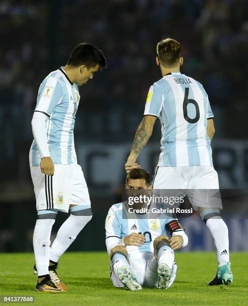 Lionel Messi of Argentina reacts after receiving a foul from Alvaro Gonzalez of Uruguay during a match between Uruguay and Argentina as part of FIFA...