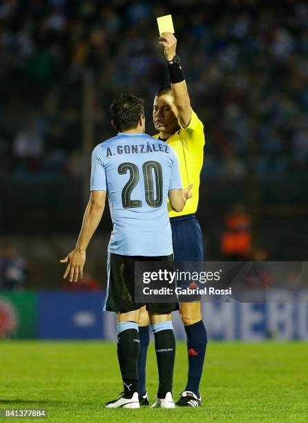 Referee Victor Carrillo shows a yellow card to Alvaro Gonzalez of Uruguay during a match between Uruguay and Argentina as part of FIFA 2018 World Cup...