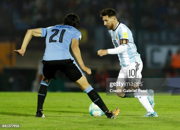 Lionel Messi of Argentina fights for the ball with Edinson Cavani of Uruguay during a match between Uruguay and Argentina as part of FIFA 2018 World...