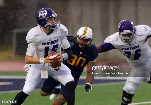 Kentucky Wesleyan quarterback Mike McGee does not see he is about to be sacked by Murray State defensive lineman Kenney Wooten during the college...