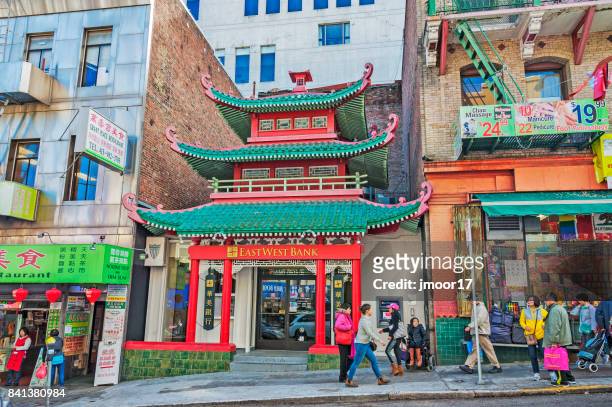 chinese architectural features and people in chinatown - chinatown san francisco stock pictures, royalty-free photos & images