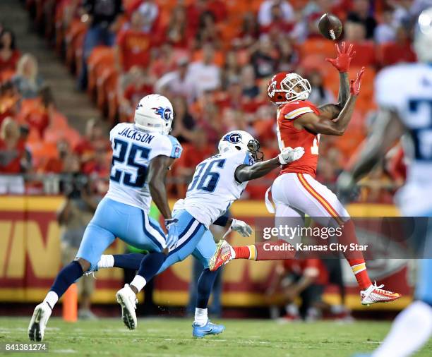 Kansas City Chiefs wide receiver Demarcus Robinson, right, catches a long pass reception for a first down from quarterback Patrick Mahomes in the...