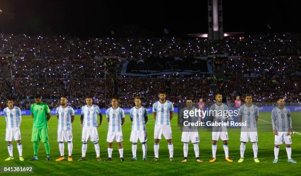 Players of Argentina sing their National Anthem prior to a match between Uruguay and Argentina as part of FIFA 2018 World Cup Qualifiers at...