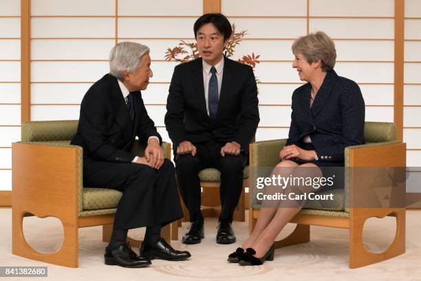 Britain's Prime Minister, Theresa May , is greeted by Emperor Akihito of Japan during her visit to the Royal Palace on September 1, 2017 in Tokyo,...