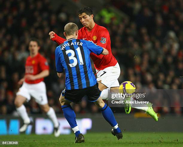 Cristiano Ronaldo of Manchester United tangles with David Wheater of Middlesbrough during the Barclays Premier League match between Manchester United...