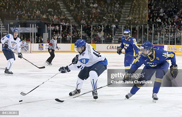 Niclas Lucenius of Team Finland stickhandles the puck against Tim Erixon of Team Sweden during the IIHF World Junior Championships held at the Ottawa...