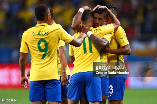 Gabriel Jesus, Philippe Coutinho and Paulinho of Brazil celebrate a scored goal against Ecuador during a match between Brazil and Ecuador as part of...