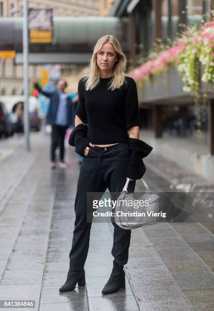 Celine Aagaard wearing black Celine knit, Loewe bag outside Valerie on August 31, 2017 in Stockholm, Sweden.