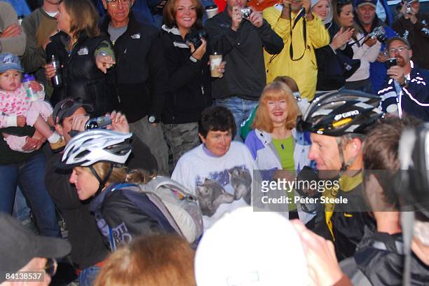 Anna Hansen and Lance Armstrong pass through a crowd at the Leadville 100 Mountain Bike race on August 9, 2008 in Leadville, Colorado.