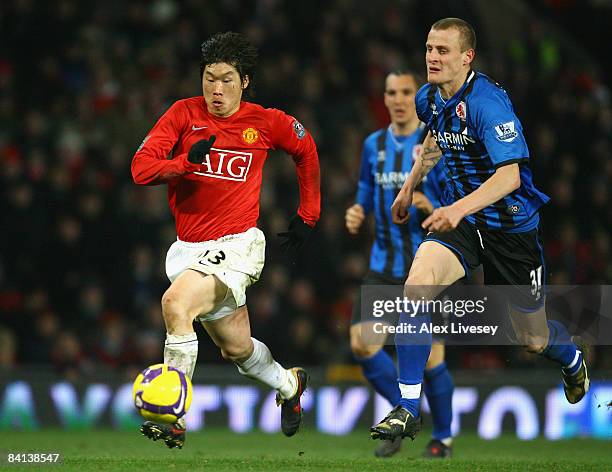 Ji Sung Park of Manchester United surges away from David Wheater of Middlesbrough during the Barclays Premier League match between Manchester United...