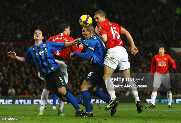 Nemanja Vidic of Manchester United beats Chris Riggott and Emanuel Pogatetz of Middlesbrough to the ball during the Barclays Premier League match...