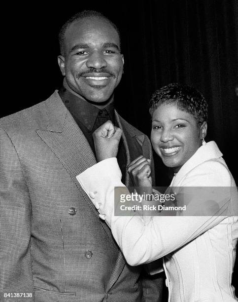 Boxing Champion Evander "The Real Deal" Holyfield and Singer/Songwriter Toni Braxton attend LaFace Records Toni Braxton platinum celebration party in...
