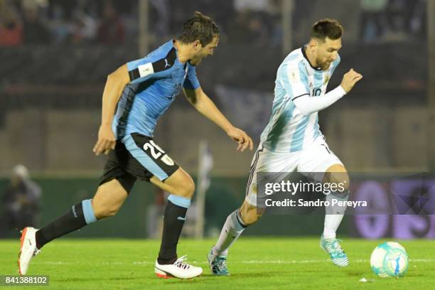 Lionel Messi of Argentina and Alvaro Gonzalez of Uruguay fight for the ball during a match between Uruguay and Argentina as part of FIFA 2018 World...