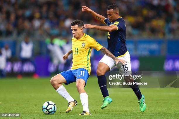 Philippe Coutinho of Brazil struggles for the ball with Pedro Quinonez of Ecuador during a match between Brazil and Ecuador as part of 2018 FIFA...