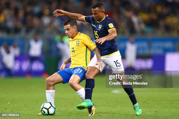 Philippe Coutinho of Brazil struggles for the ball with Pedro Quinonez of Ecuador during a match between Brazil and Ecuador as part of 2018 FIFA...