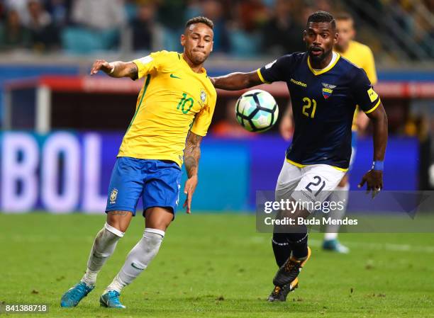 Neymar of Brazil struggles for the ball with Gabriel Achilier of Ecuador during a match between Brazil and Ecuador as part of 2018 FIFA World Cup...