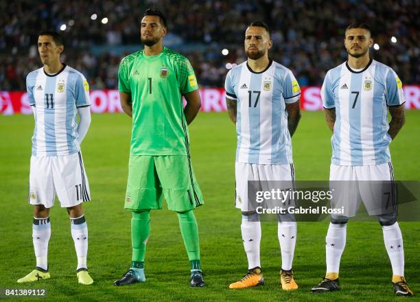 Angel Di Maria, Sergio Romero, Nicolas Otamendi and Mauro Icardi of Argentina line up for the National Anthem prior to a match between Uruguay and...