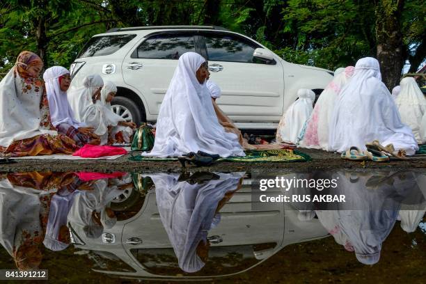 Indonesians attend an Eid al-Adha prayer in Padang, West Sumatra province on September 1, 2017. Muslims in Indonesia are celebrating Eid al-Adha, the...