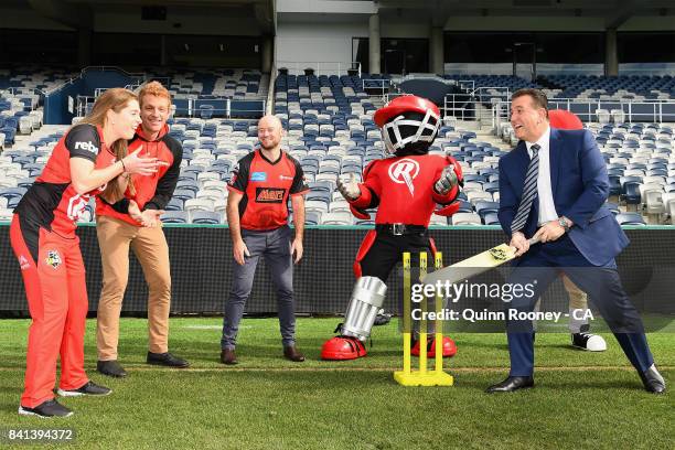 Sport Minister John Eren plays cricket with Sophie Molineux, Andrew McDonald and Tim Ludeman of the Renegades and the Renegades mascots during a...