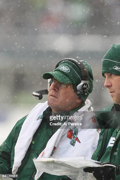 Assistant Head Coach/Offensive Line Bill Callahan of the New York Jets watches the action in the snow against the Seattle Sehawks on December 21,...