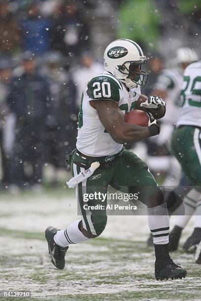 Running Back Thomas Jones of the New York Jets has a long gain in the snow against the Seattle Seahawks on December 21, 2008 when the New York Jets...